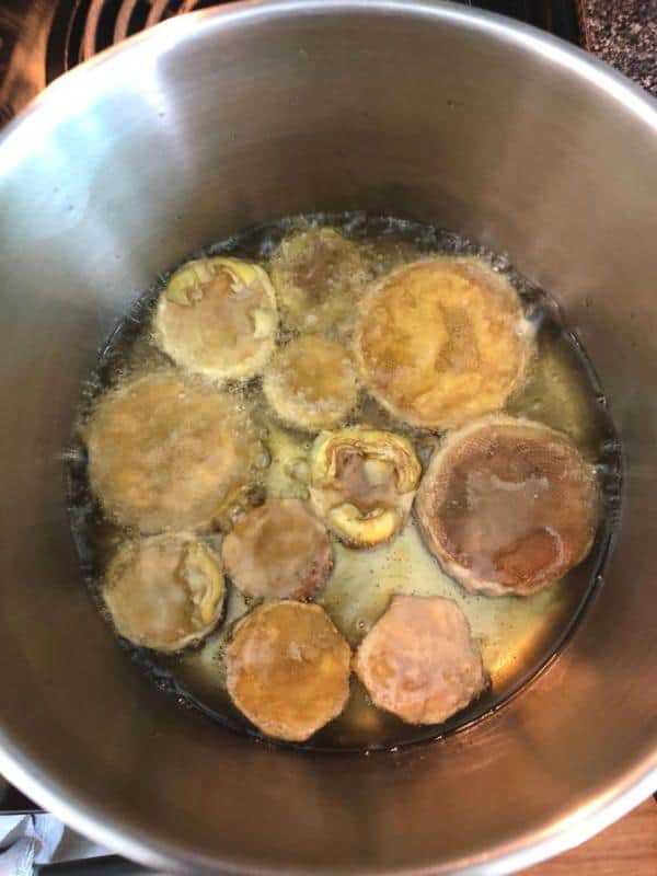 Frying artichoke bottoms after cleaning all the leaves