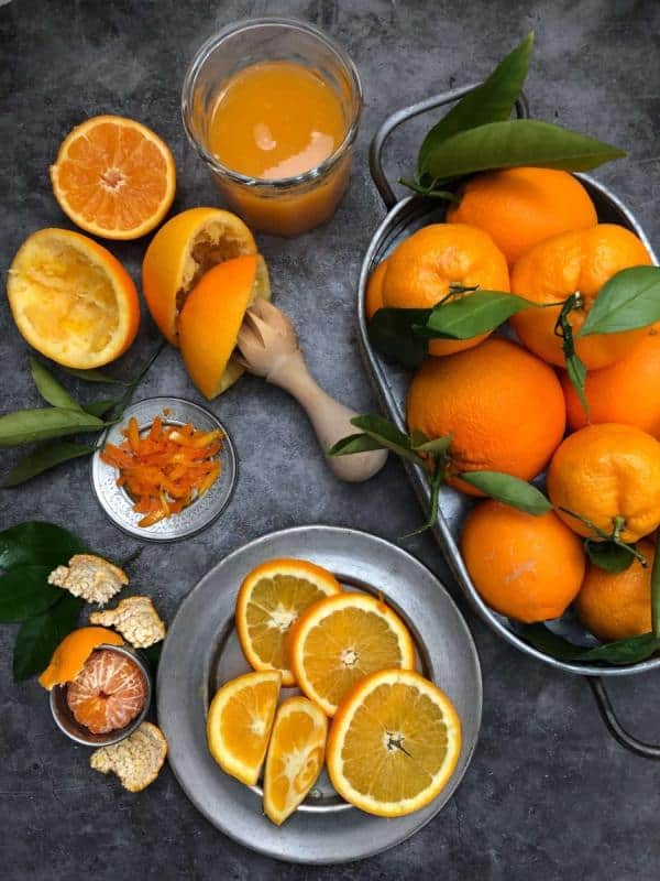 oranges in service bucket sliced oranges on plate