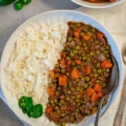 Cooked pea stew in a plate served with rice