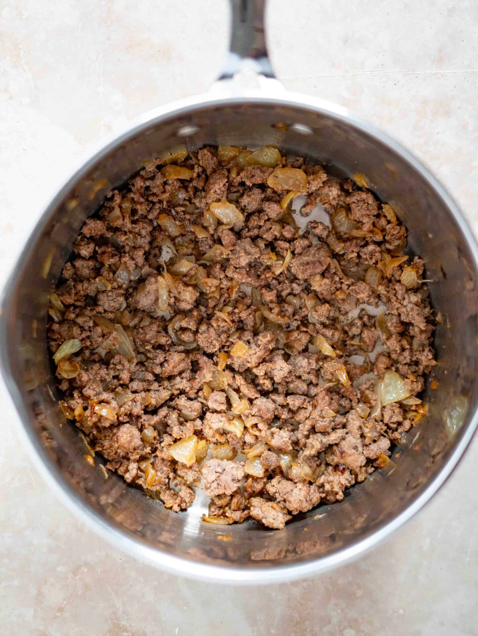 Ground meat sauted with onions in a pot