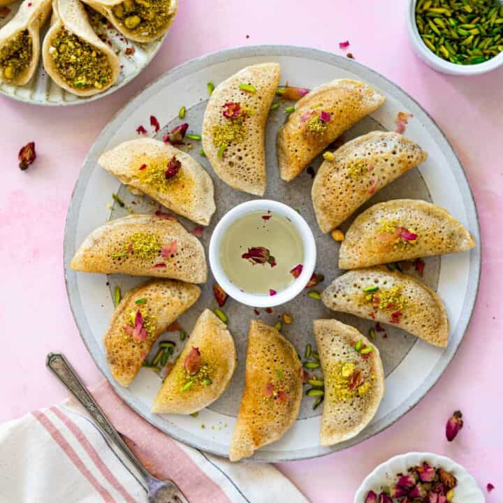 Featured photo. Close up photo for baked atayef drenched with sugar syrup.