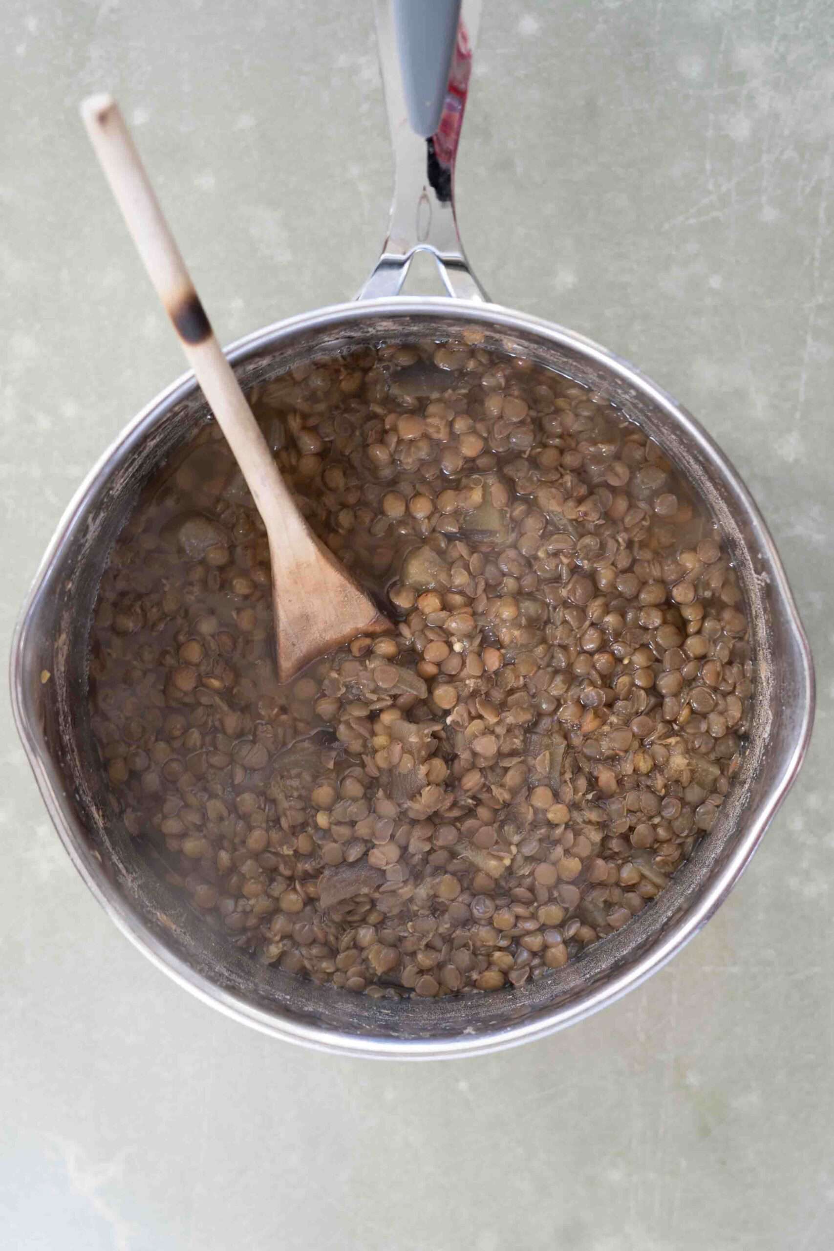 Cooked lentils and eggplant in a pot