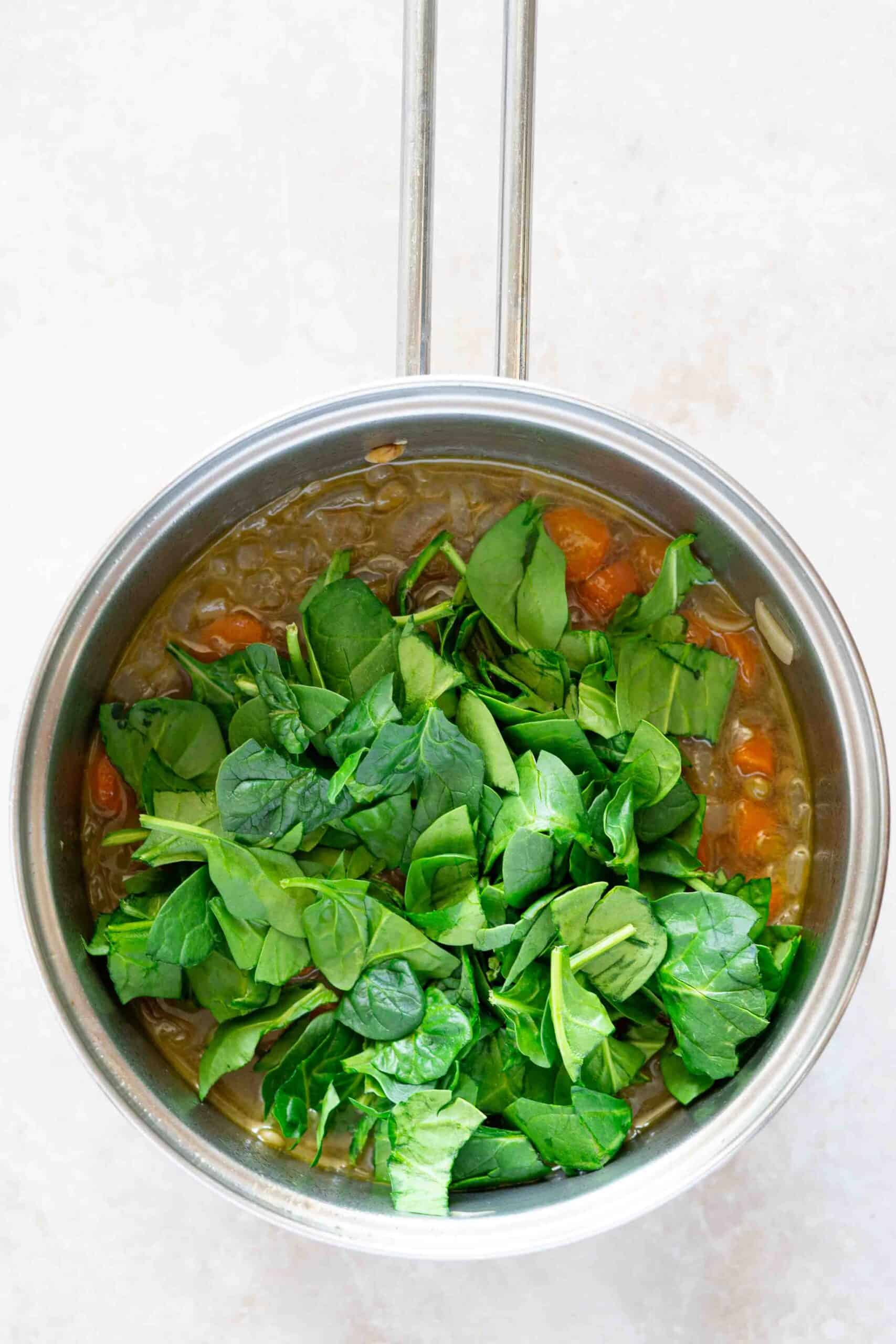 Adding Spinach over the Soup