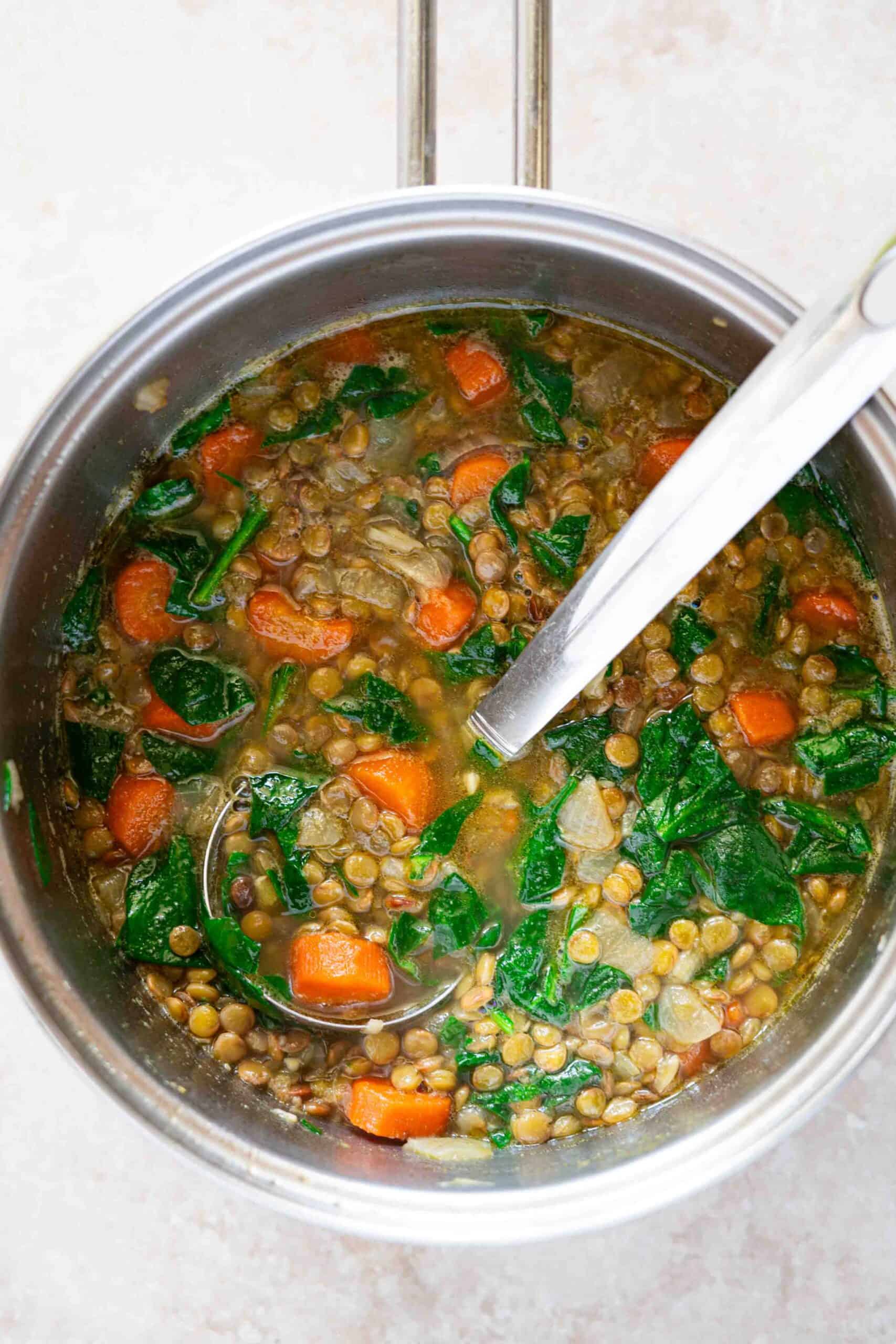 Carrot lentil soup in a pot