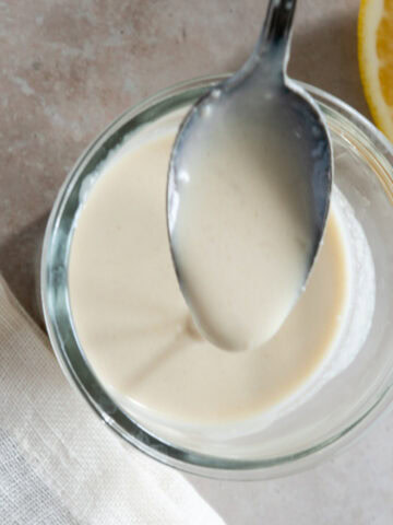 Tahini maple syrup on a spoon - feature photo