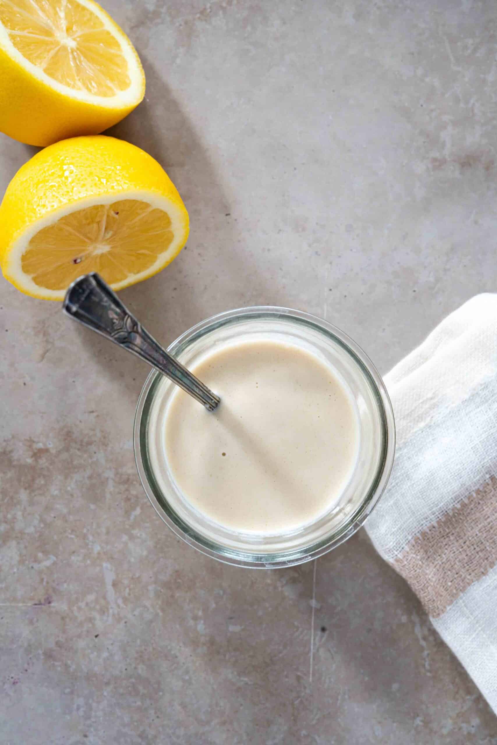 Tahini maply dressing in a small jar