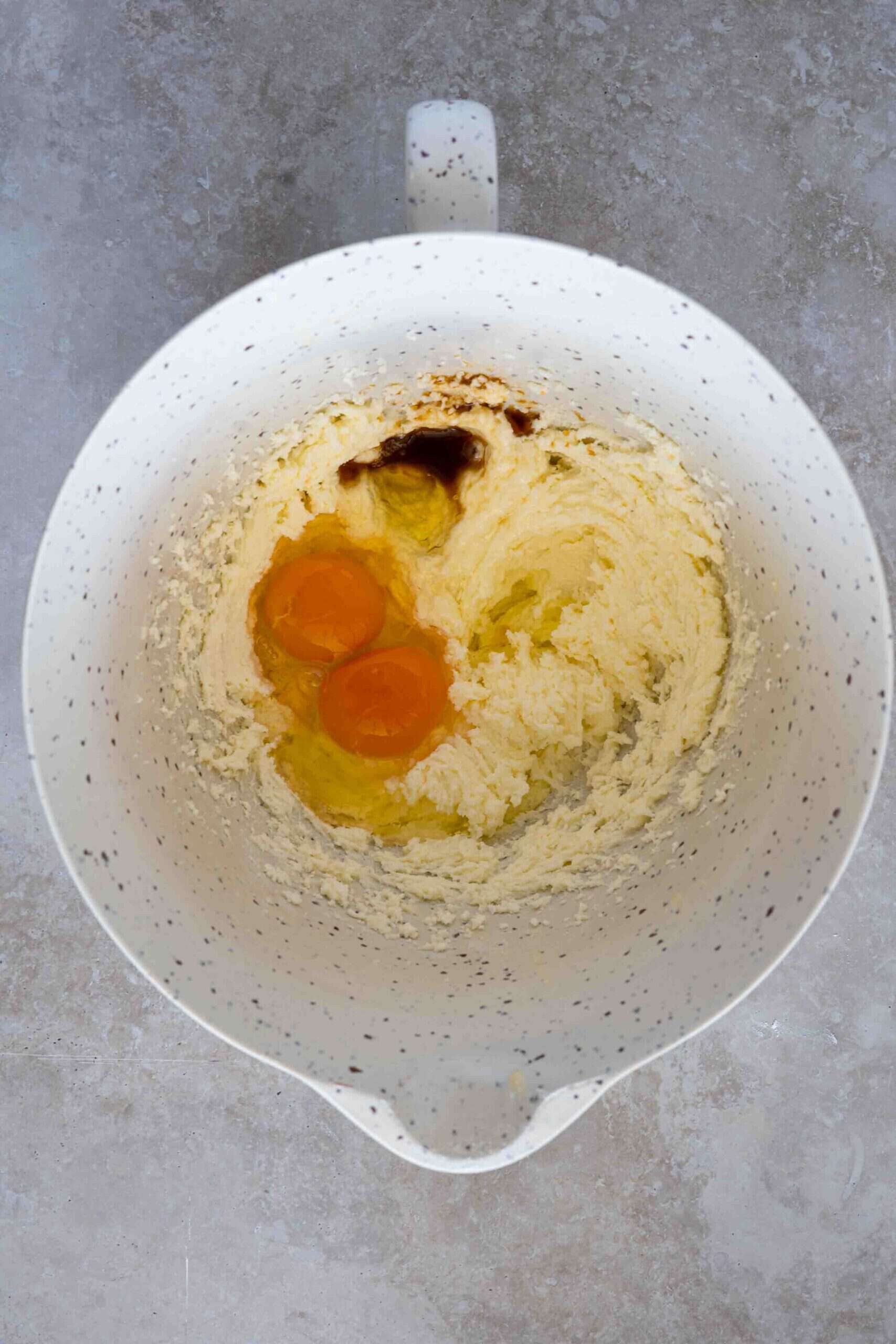 adding eggs over butter mixture