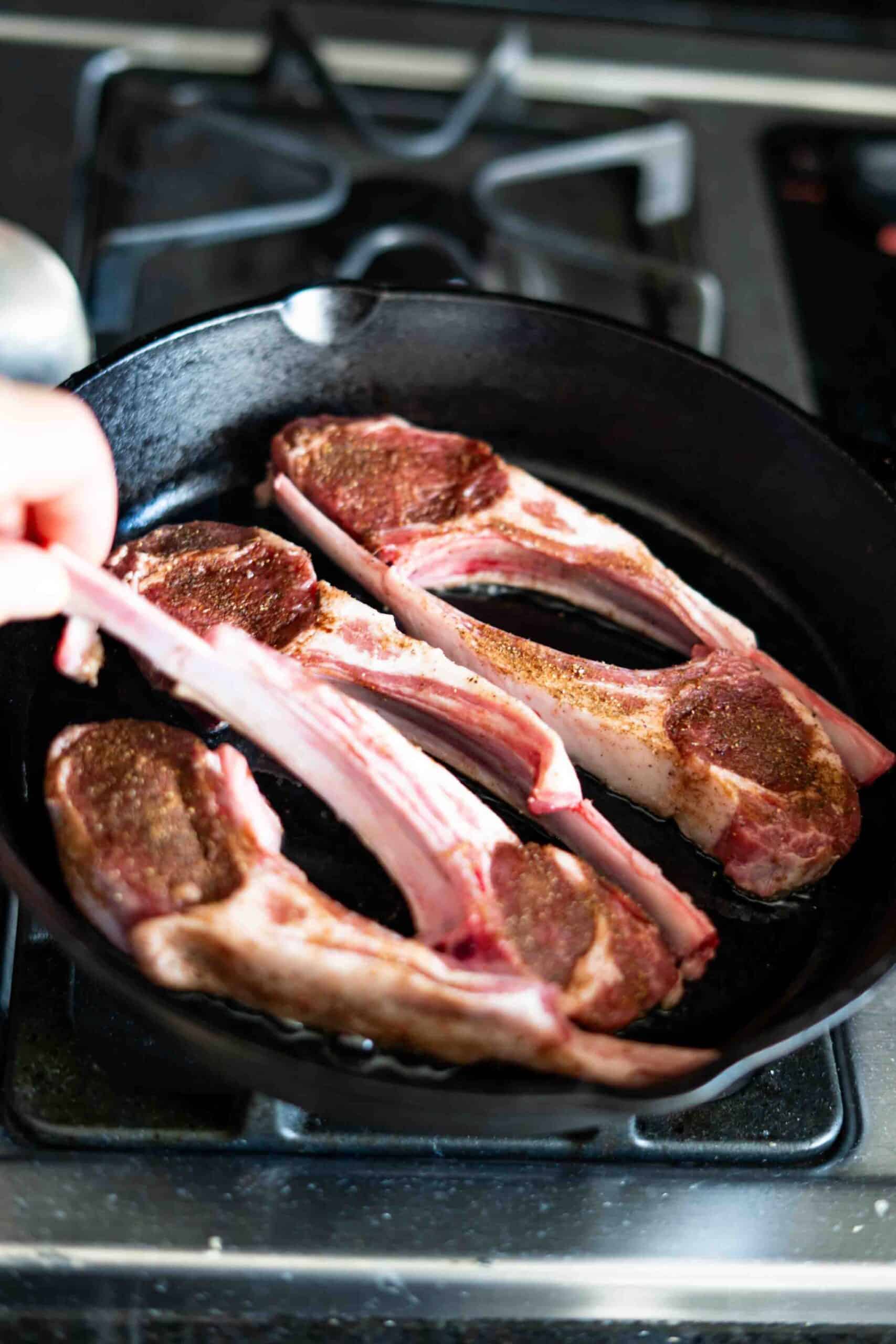 flip lamb chops while cooking in cast iron