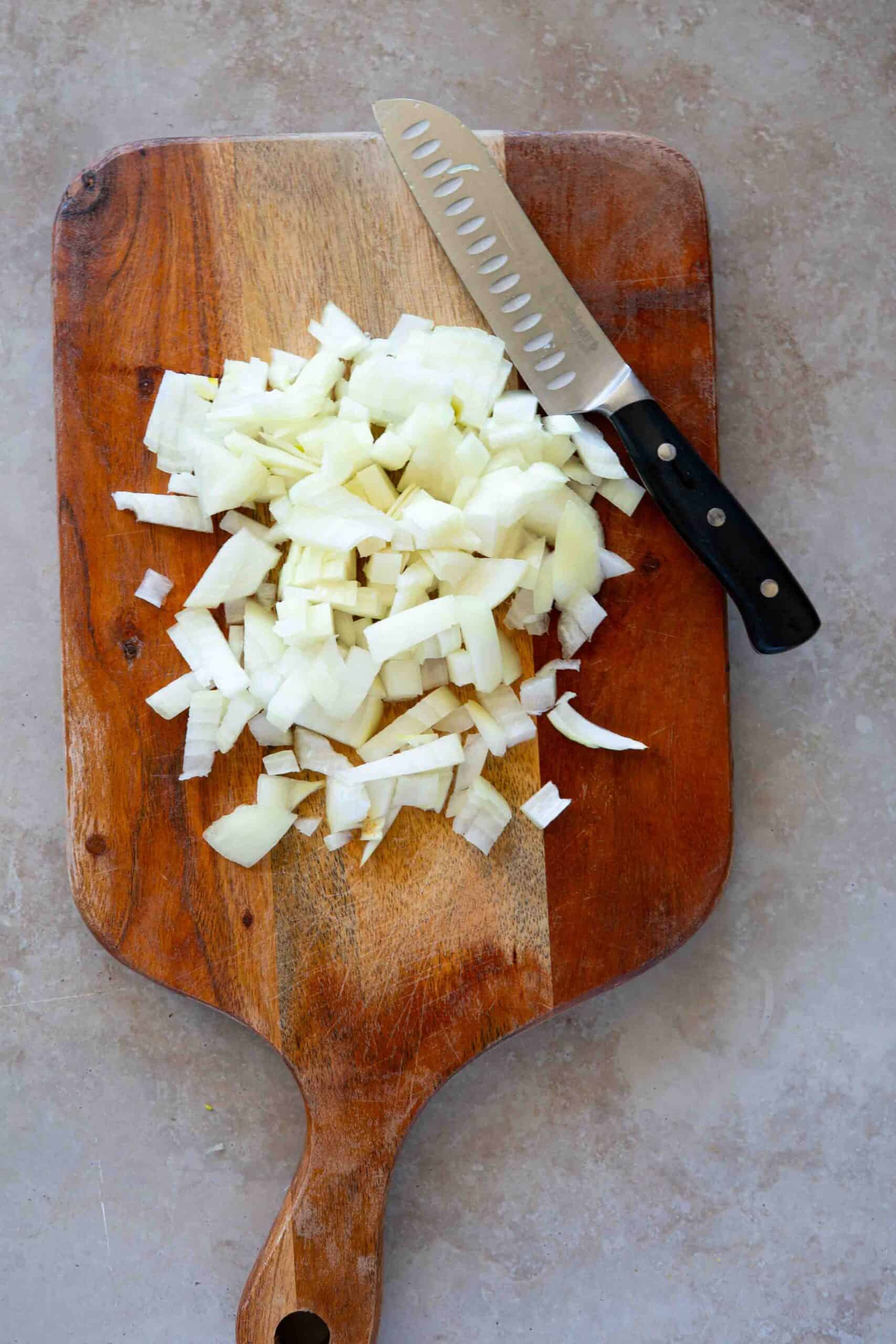 Chopped onions on cutting board