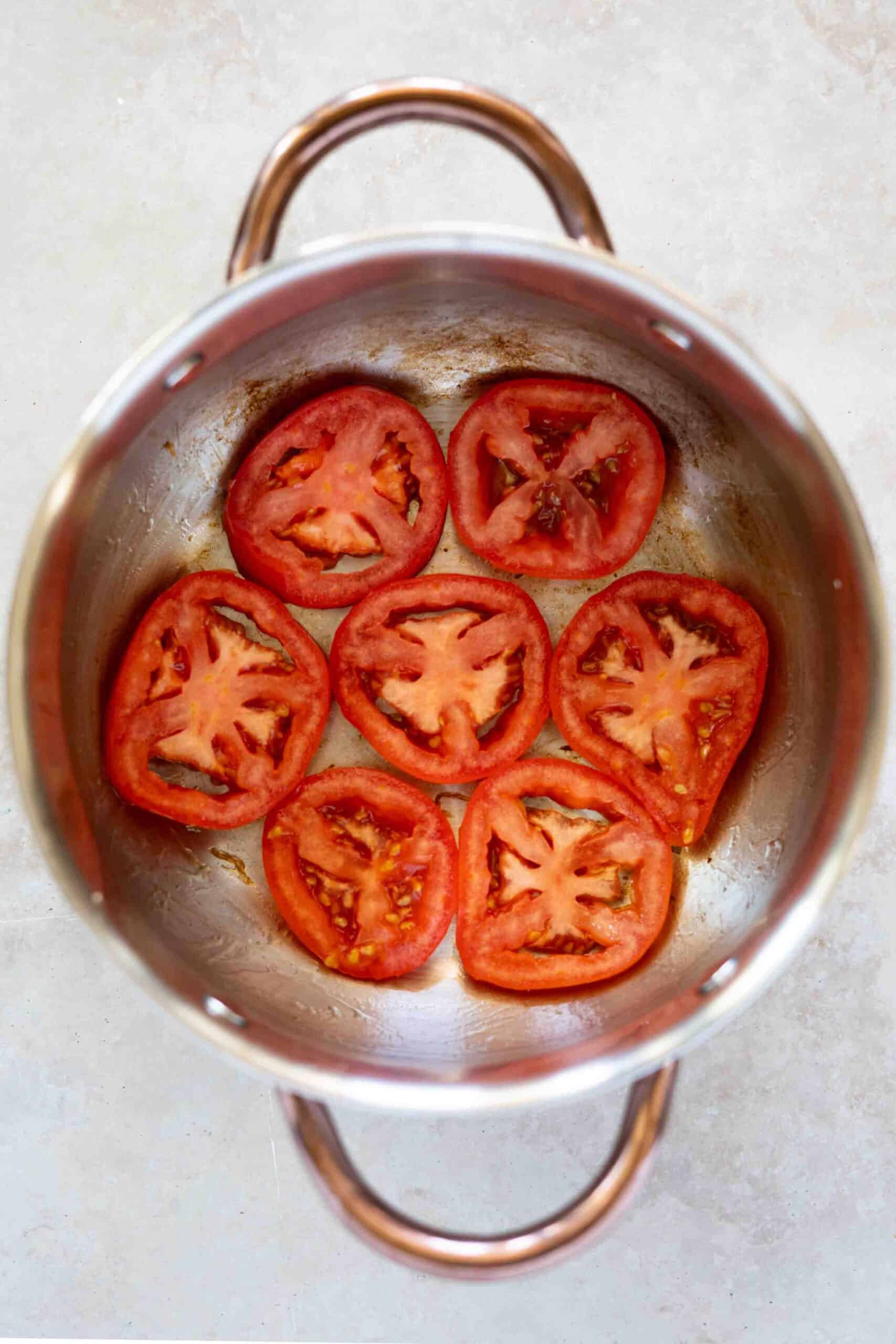 sliced tomatoes in a pot