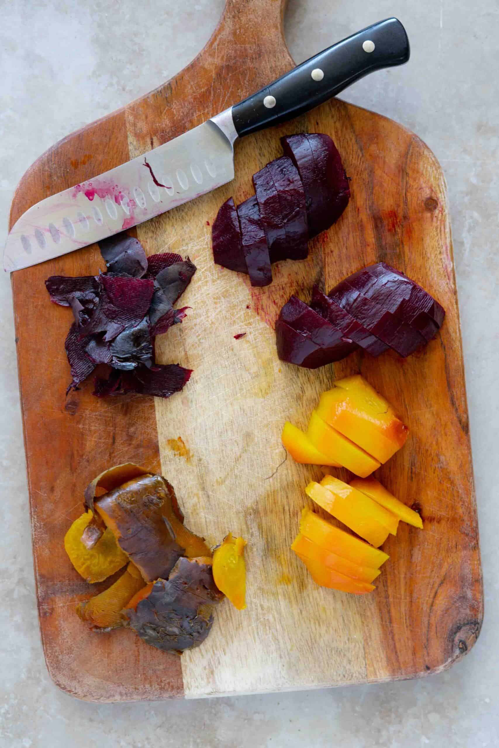 Roasted beets sliced on a cutting board