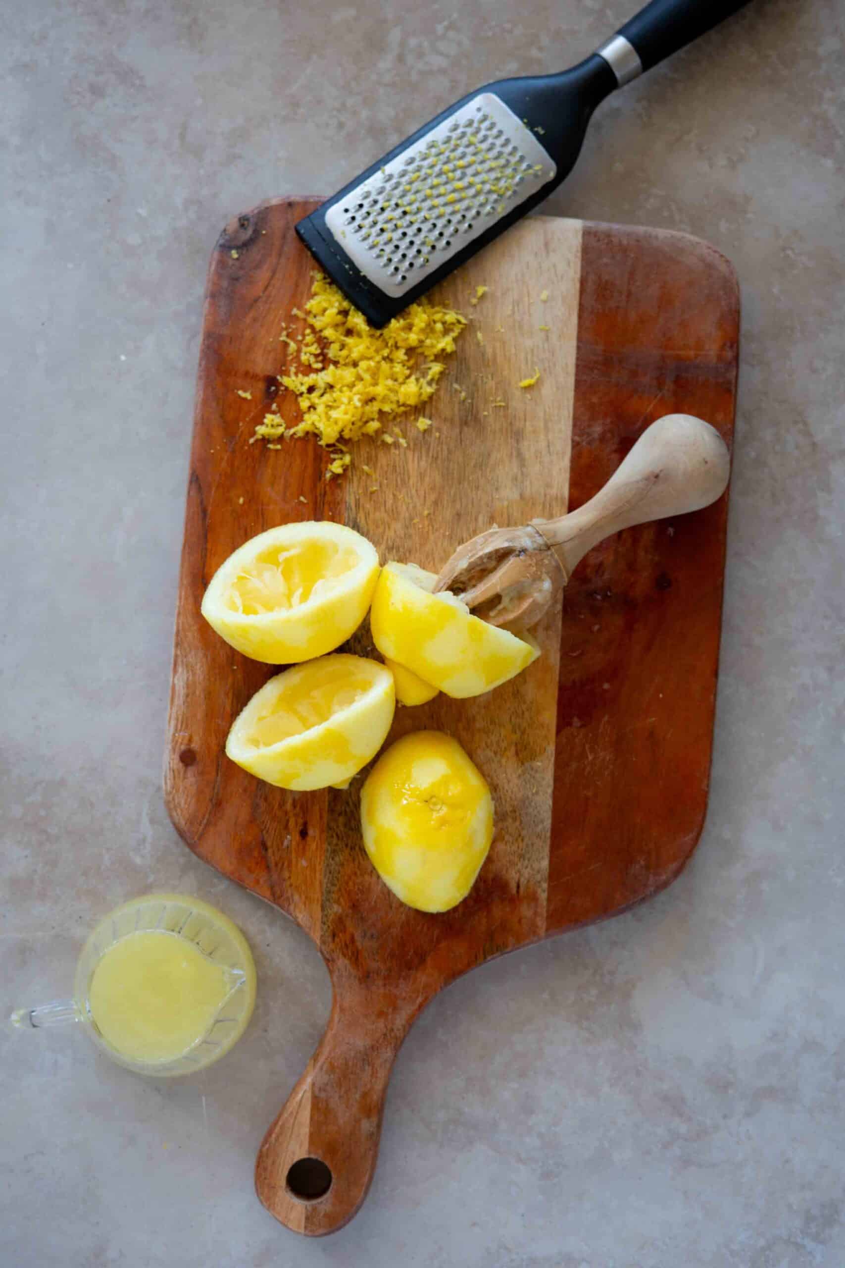 Zesting the lemon first, then cut it in half and squeezing out the juice