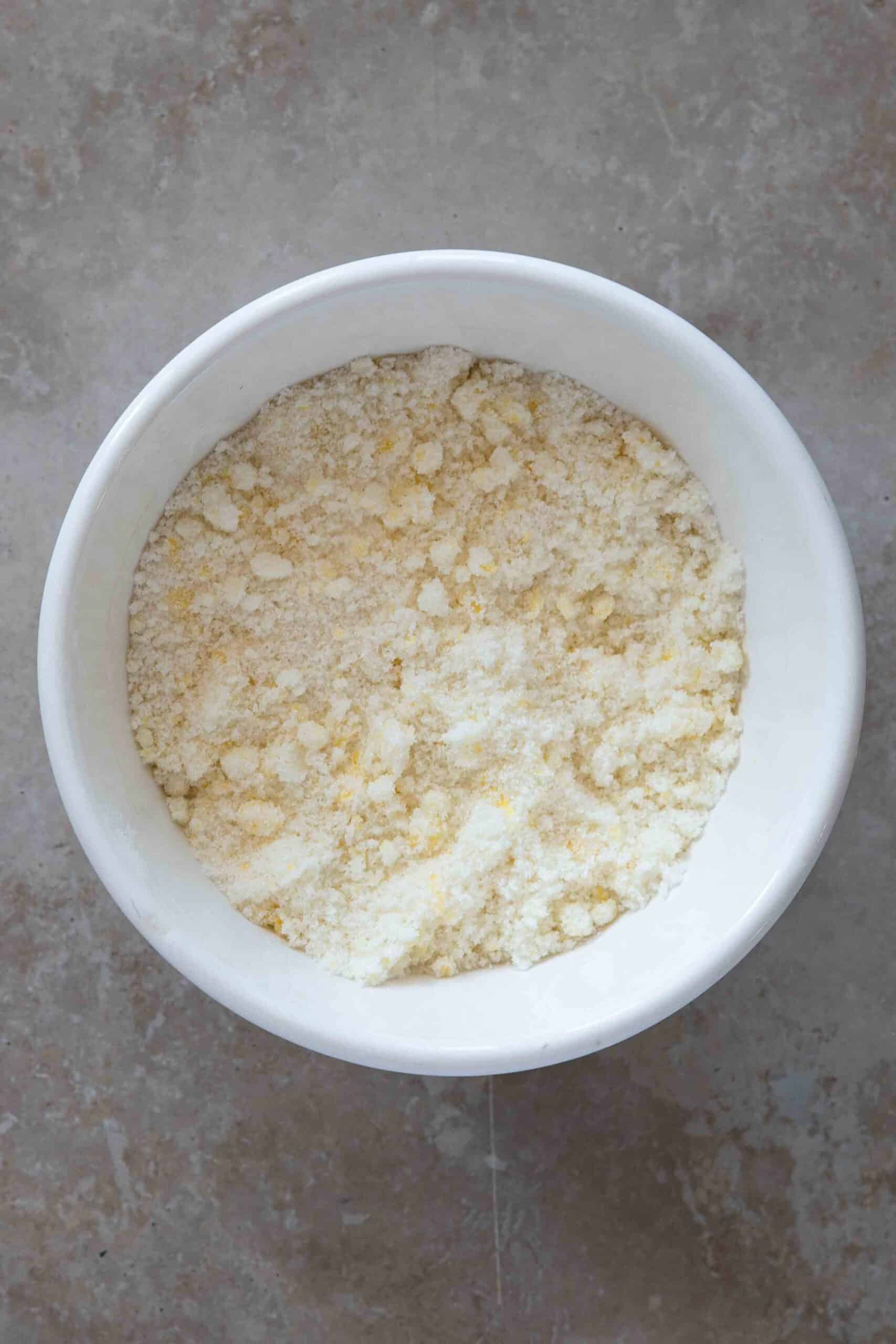 In a bowl, rub the lemon zest into the sugar with your fingertips until the sugar is fragrant and lightly tinted with the zest’s oils