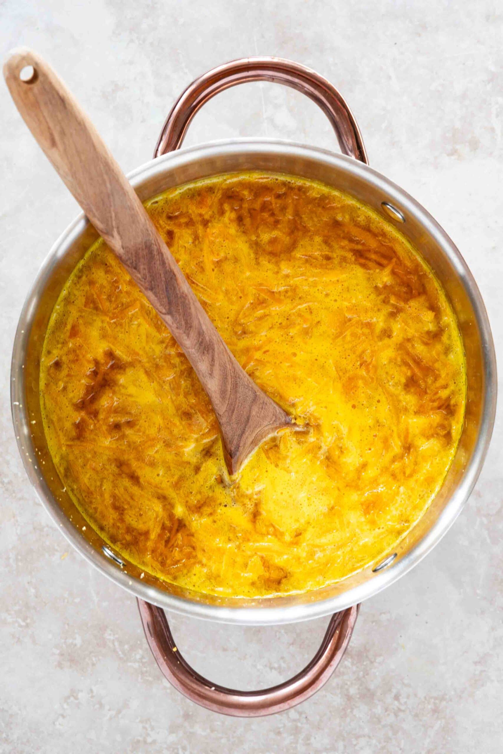 Orange jam mixture in a pot boiling