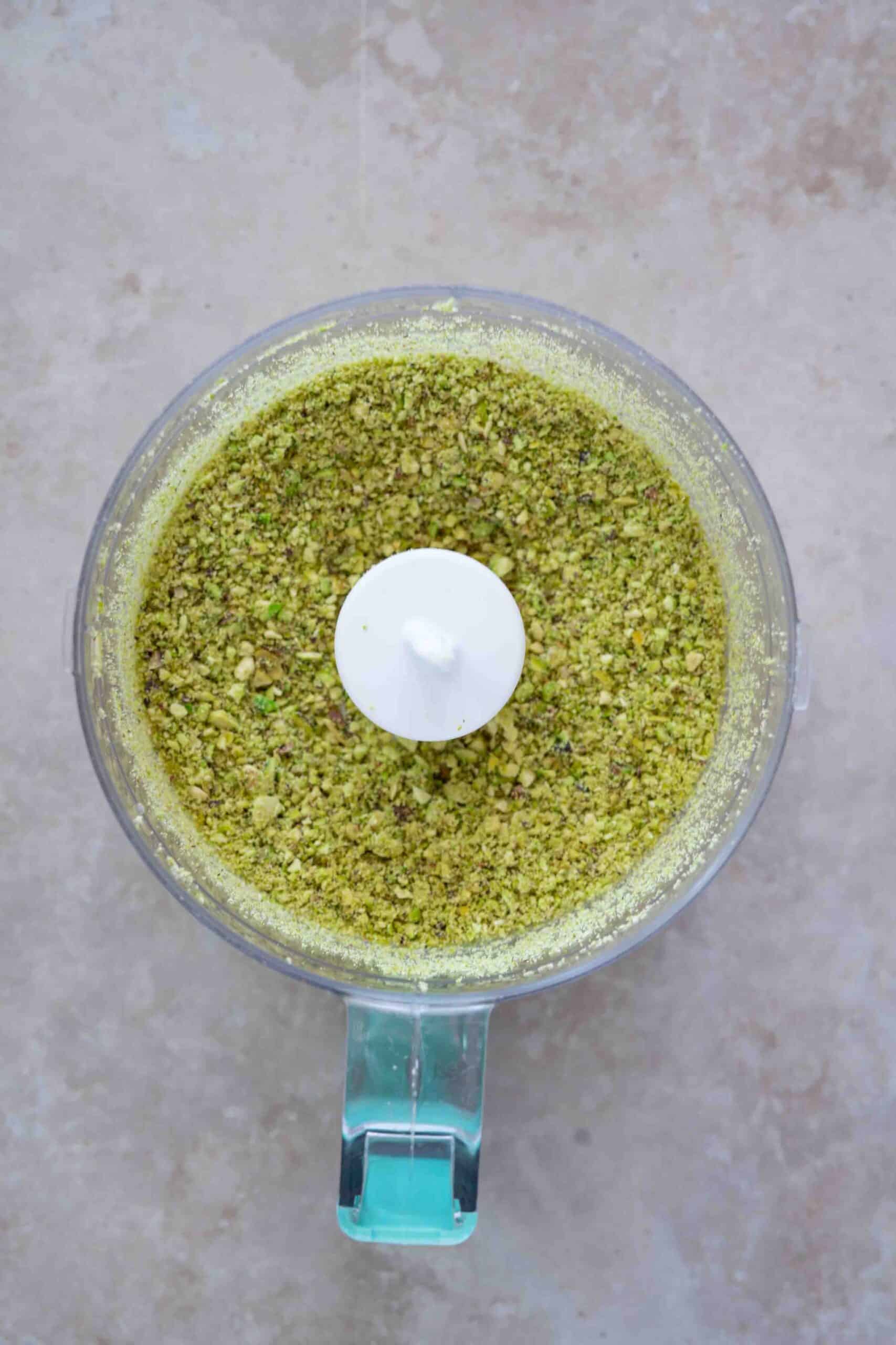 Grinding the pistachios in grinder.