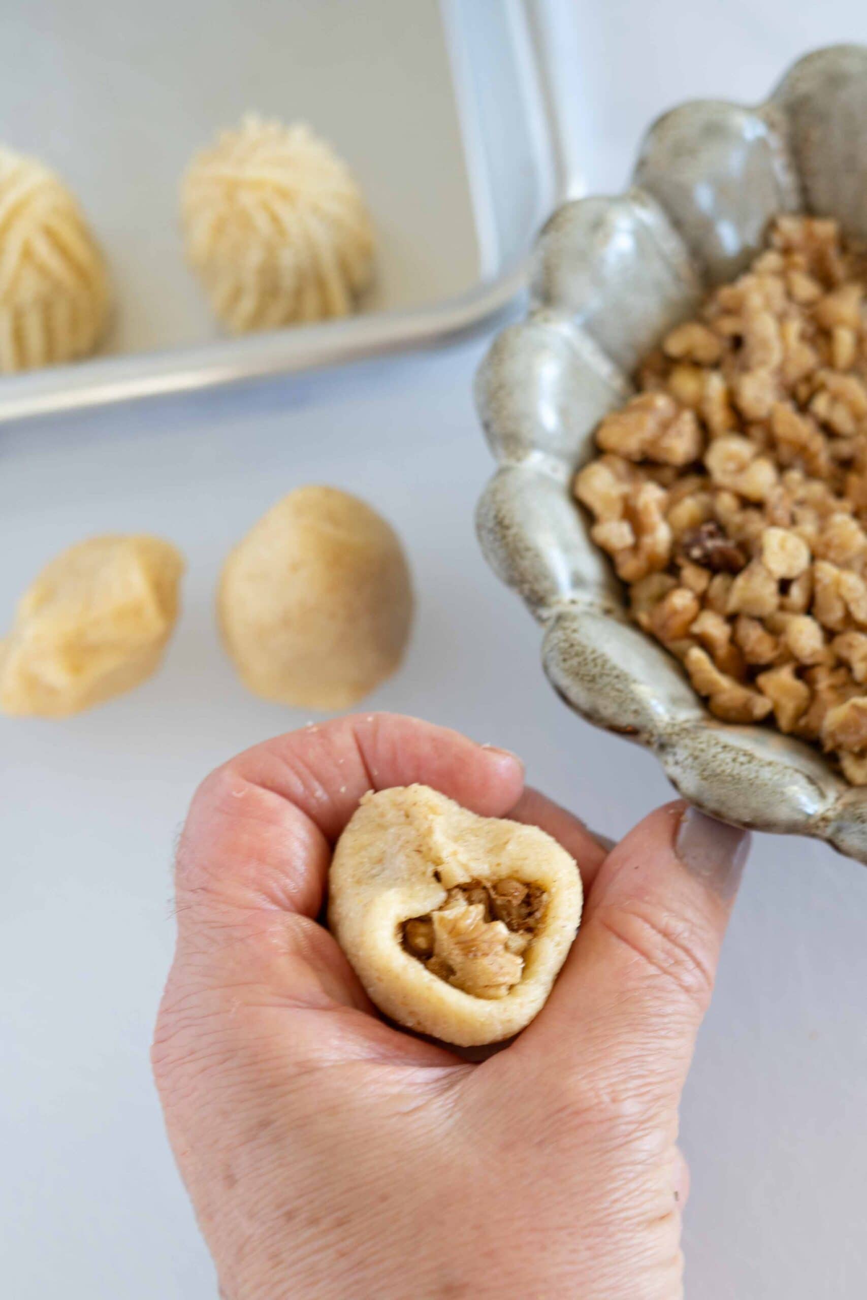 Seal the top carefully and shape the dough back into a smooth dome.