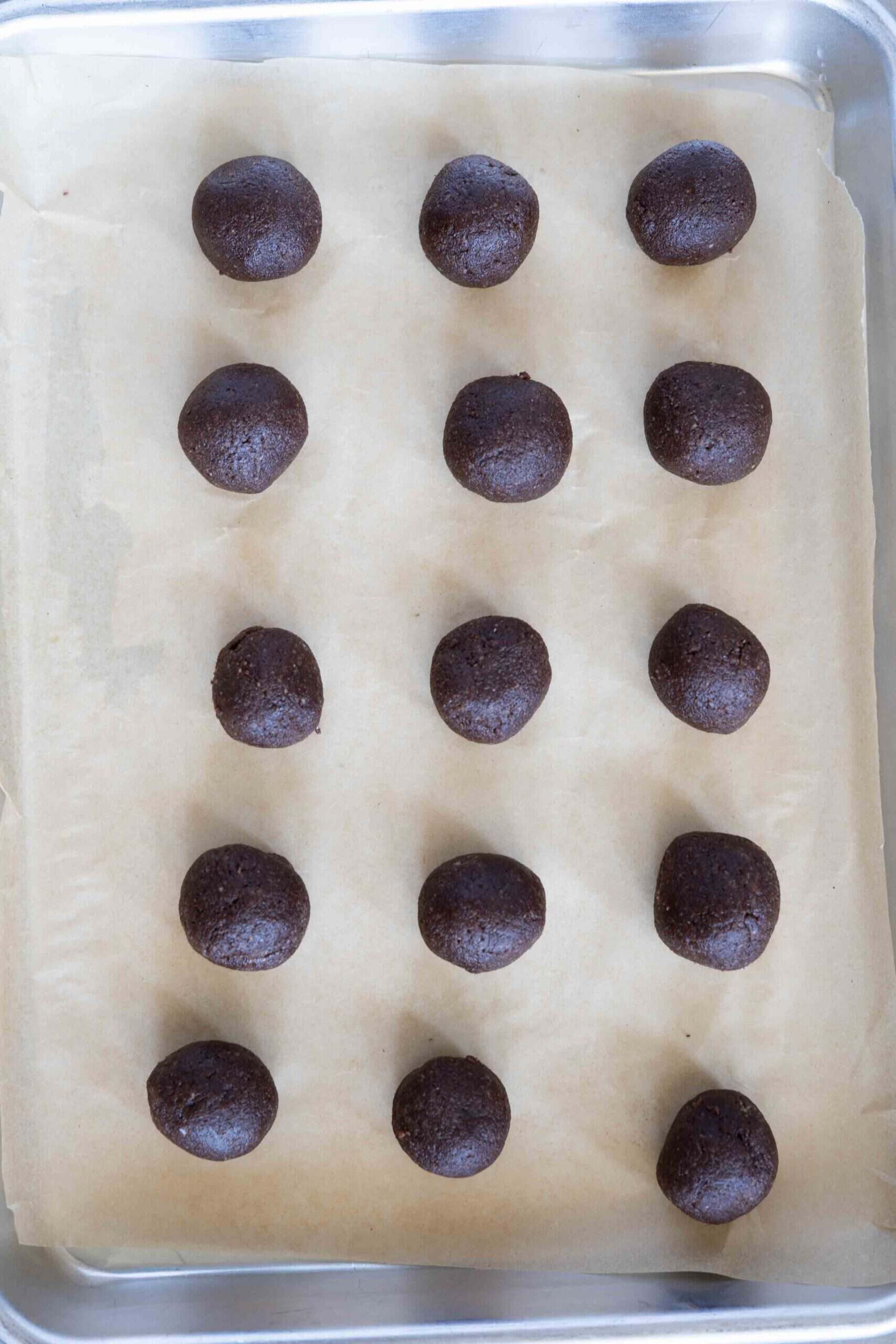Mixture rolled into small balls and placed on a baking sheet lined with parchment paper.