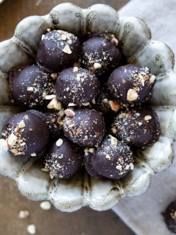 Tahini chocolate balls in a bowl - featured photo