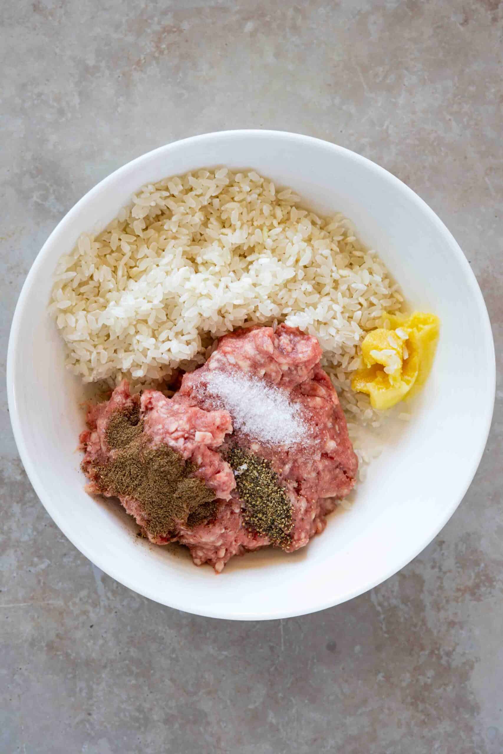 Meat, rice, spices and ghee in a plate