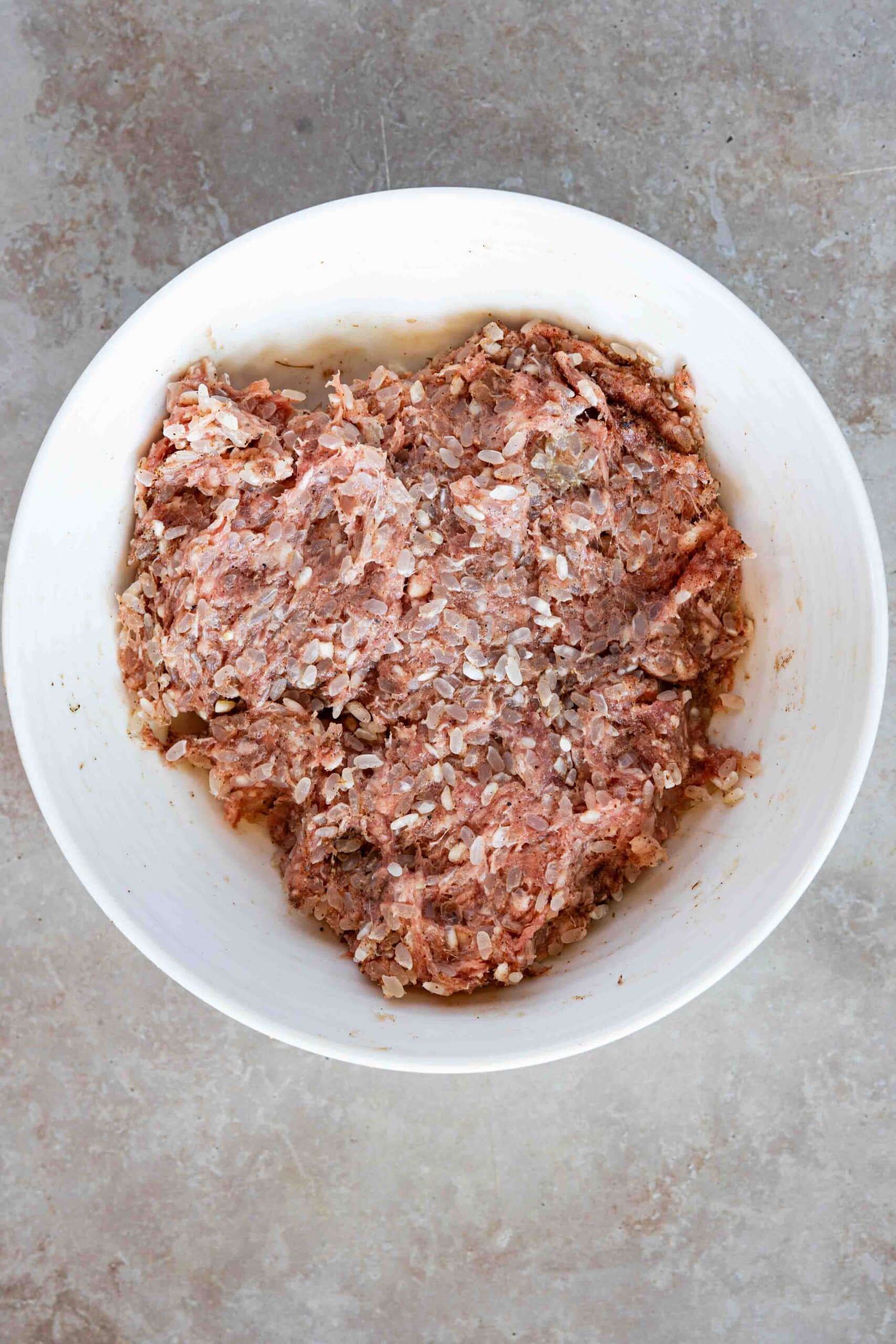 Meat, rice, ghee and spices well mixed