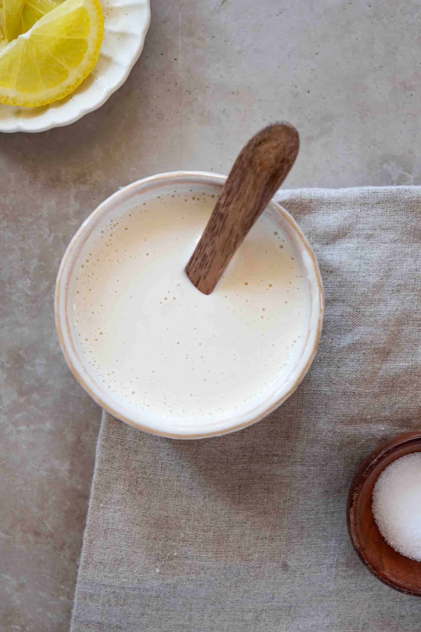 Shawarma sauce with a spoon in a small ball.