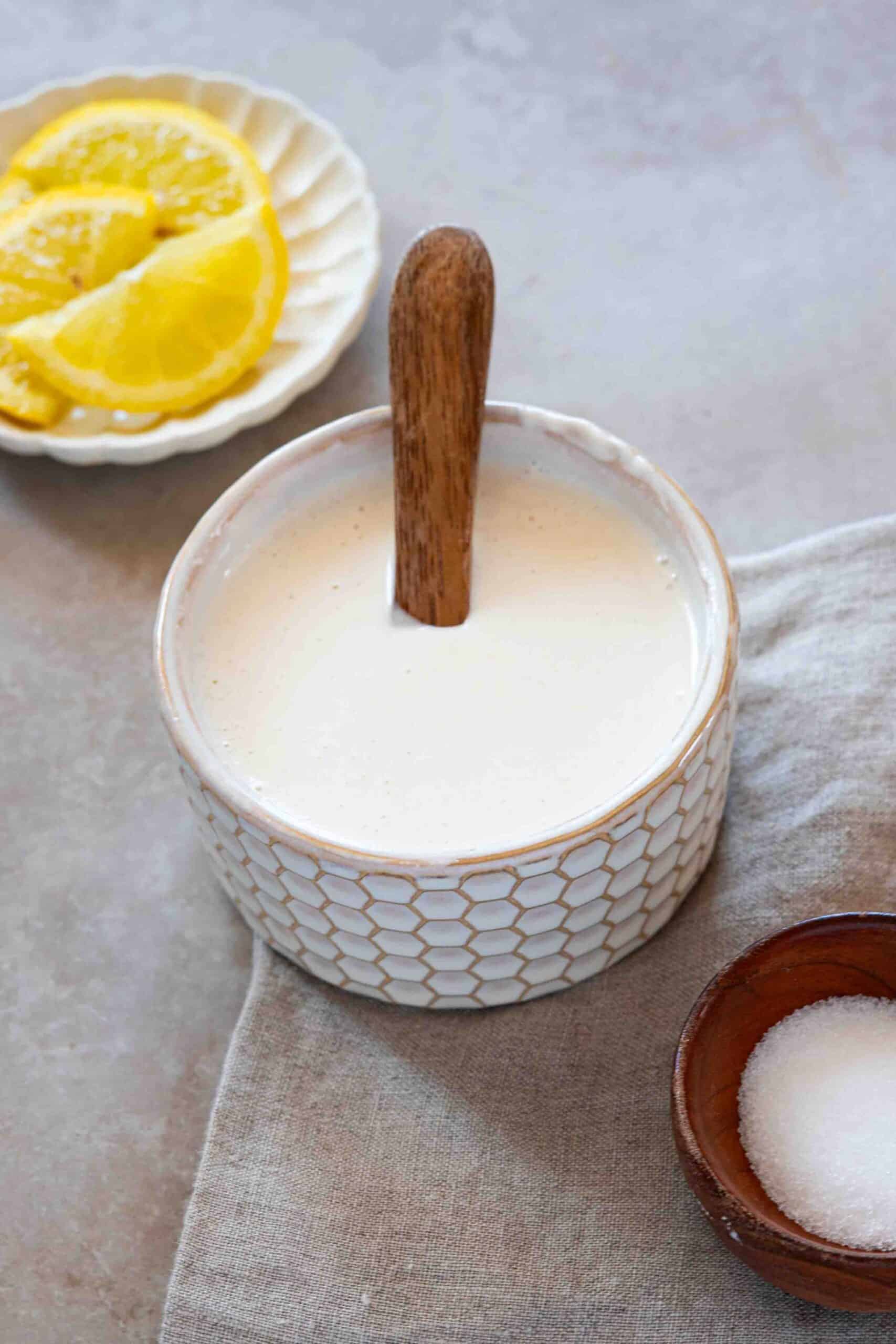 Shawarma sauce with a spoon in a small ball.