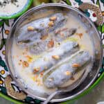 Traditional Palestinian Malfouf Dolma served with yogurt and pine nuts.