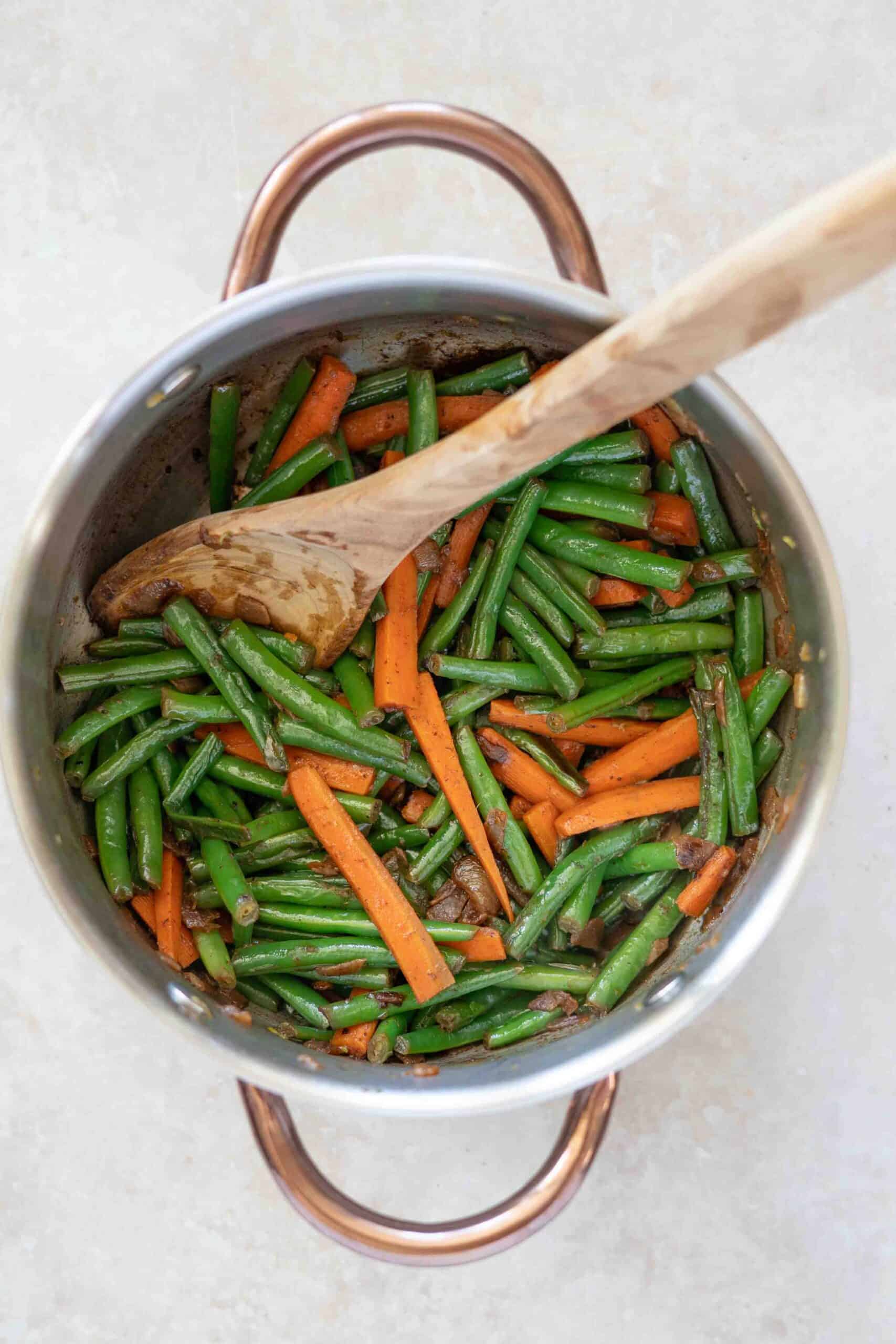 Carrots and beans in pot ready