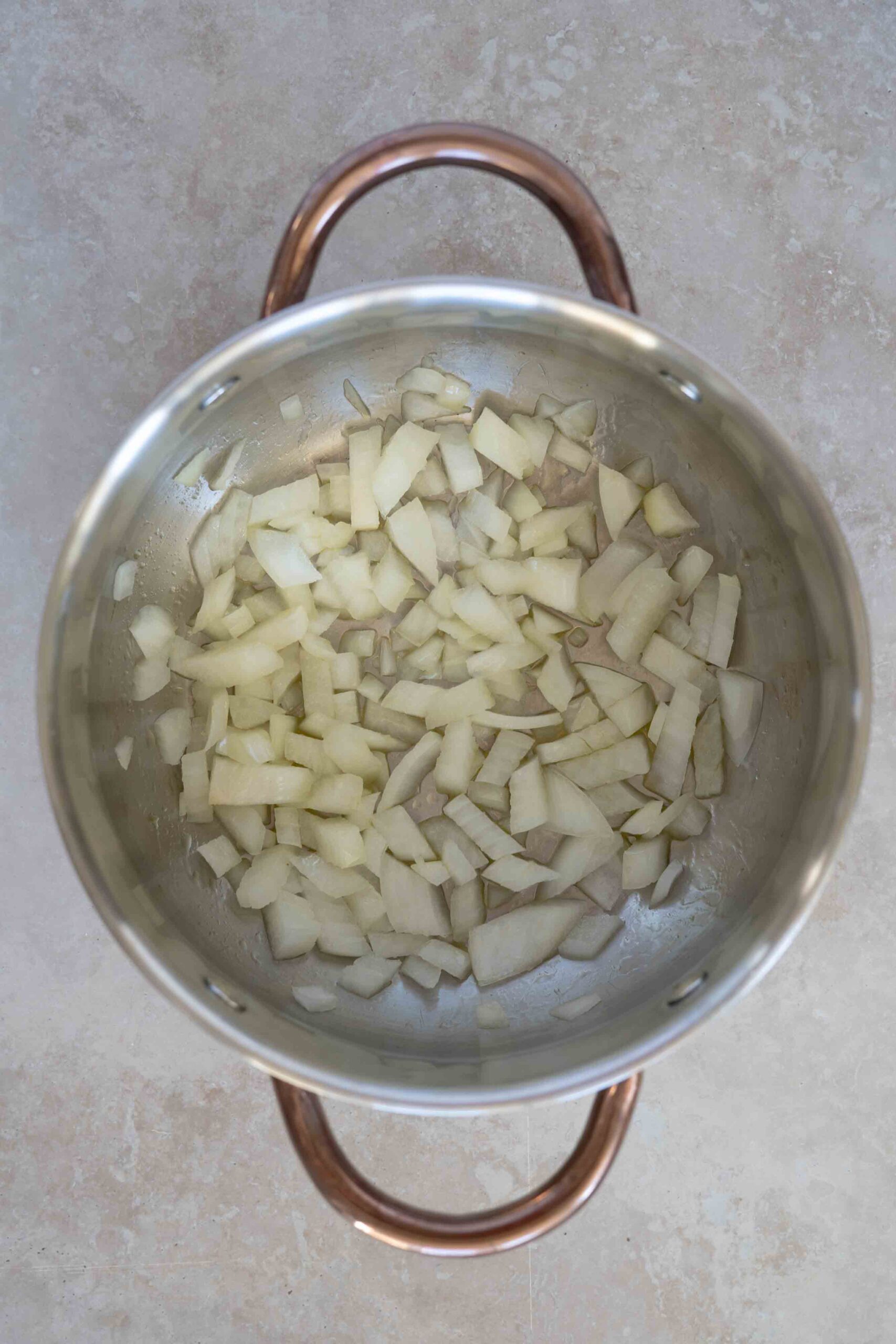 Onions chopped and placed over olive oil in pot